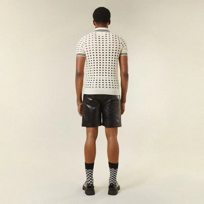 Polo-T-shirt i öppen mesh-stickning